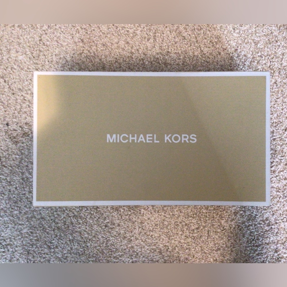 Brand new MK sneakers. Never worn.